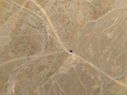 Aerial view, Vast empty landscape, Road and off-road vehicle, Top down view, Two paths divide, Symbolic for decisions, Moldo Too mountains, Naryn region, Kyrgyzstan