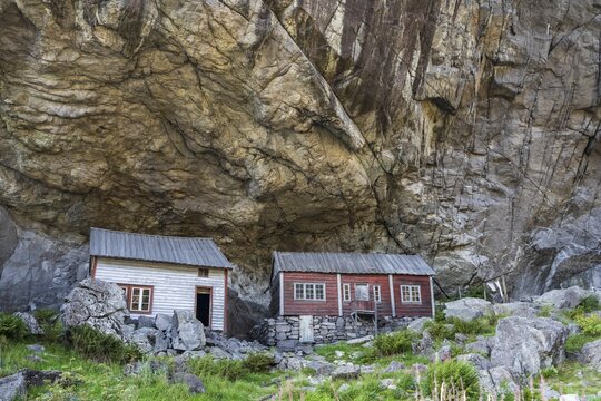 Helleren, houses under rock face, J&oslash;ssingfjord, Sokndal, Rogaland, Norway