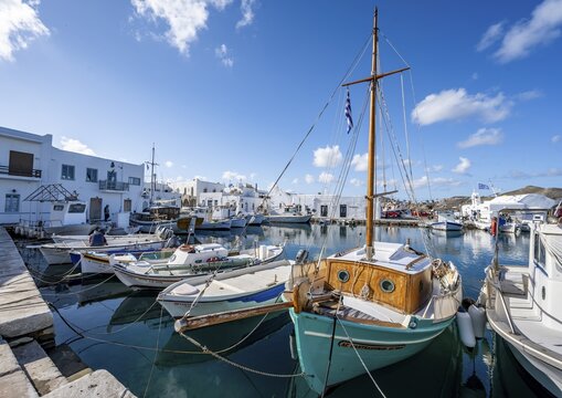 Fishing boats in Naoussa harbour, White Cycladic houses, Naoussa, Paros, Cyclades, Greece