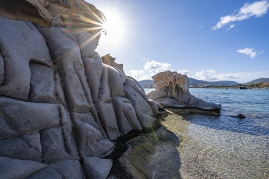 Rock formations on the coast with turquoise sea, Sun Star, Kolimbithres beach, Paros, Cyclades, Aegean Sea, Greece