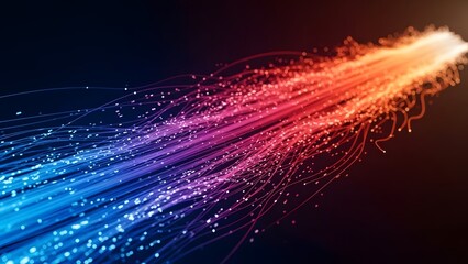 High speed fiber optic cables and data transmission. Broadband internet and telecommunications. Glowing multi colored light trails moving through a dark space.