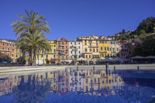 Row of houses reflected in a fountain, Lerici, Province of La Spezia, Italy