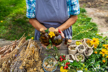 Medicinal herbs alternative medicine old woman. Selective focus. © yanadjan