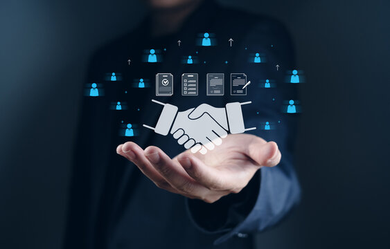 touch partner affiliate marketing global business collaboration concept A person hand displaying virtual handshake and business icons representing collaboration and networking
