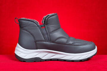 grey insulated sneaker for boy or man on red