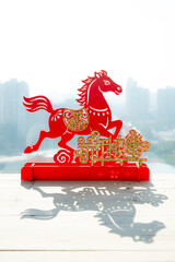 Chinese New Year of Horse 2026 mascot with shadow at vertical composition translation of the Chinese words are Happy New Year no logo no trademark