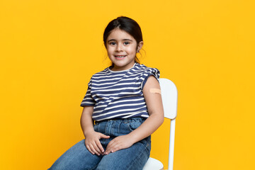 Cute Vaccinated Little Girl Showing Arm With Adhesive Bandage After Injection Shot, Smiling Preteen...