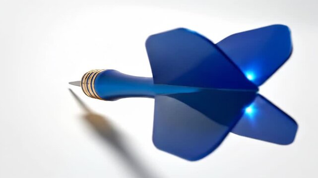 A blue dart flying through the air with a gold tip