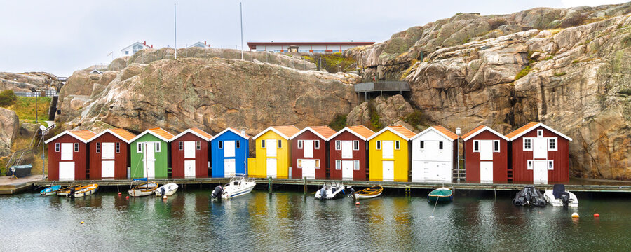 Colorful coastal boathouses along rocky Smogen harbor in Vastra Gotalands Ian, Sweden
