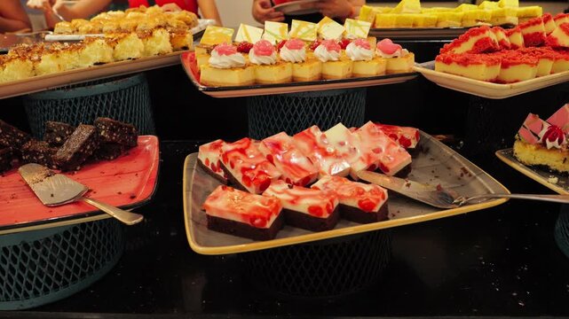 Dessert buffet with a stunning array of pastries, fruit tarts, and sweet treats. High quality 4k footage