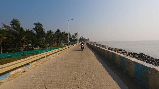 Young Woman Riding Motorcycle Along Marine Drive Beside Bay of Bengal, Mandarmani to Digha