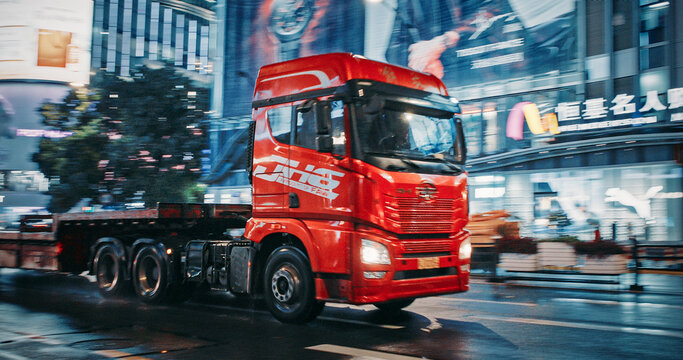 Shanghai, China. Large Red Faw Truck. Drive Along Street. Night