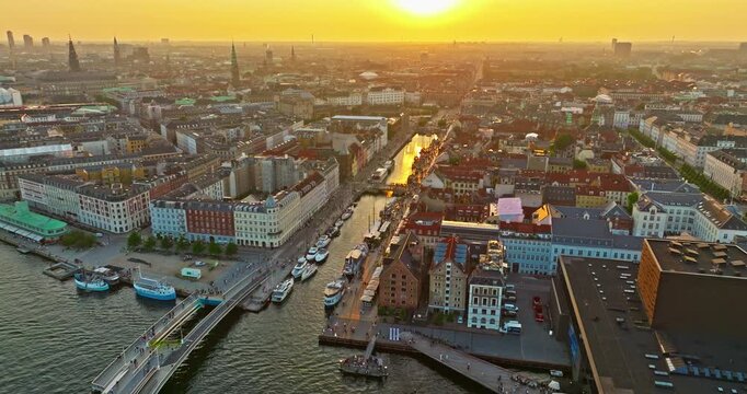 Aerial view of the Nyhavn waterfront in Copenhagen at sunset. One of the city's main attractions, Denmark
