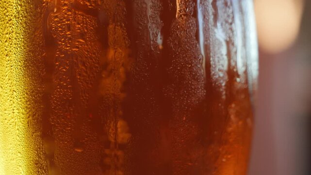 Fresh, fogged glass of light beer, refreshing and cool close-up footage. Alcoholic and non-alcoholic drinks in a pub. High quality 4k footage