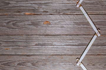 Weathered Wooden Background With Zigzag Folding Ruler For DIY Projects

