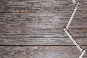 Rustic Wooden Workbench Background With Zigzag Folding Ruler
