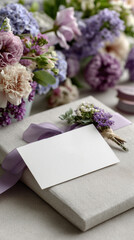 Flat lay wedding invitation cards, elegant set. Craft envelopes, paper invitations, purple ribbons, name place card. Floral decorations on a background of purple lilac flowers. Vertical top view.