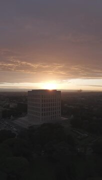 Aerial view of the Palazzo della Civilt&agrave; Italiana (Square Colosseum) at golden hour sunset. Drone flight over the EUR district in Rome, Italy, featuring rationalist architecture.