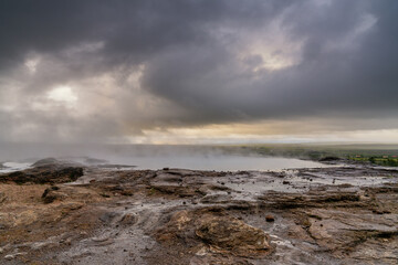 Obraz premium boiling and steaming geothermal pool in Geysir in the Haukadalur Valley in Iceland