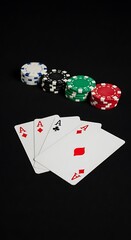 Obraz premium Aces High - Poker Hand with Chips on Black Background, Casino Night.