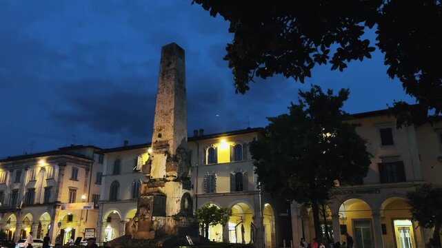 Scenic twilight view of monument obelisk at Piazza Colle di Val d'Elsa in Tuscany, Italy