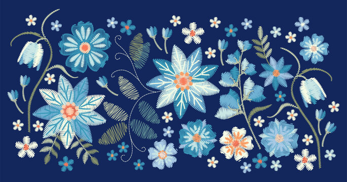 Beautiful light blue flowers on dark blue background. Floral embroidery. 