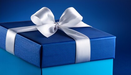 a blue gift box with a white ribbon and bow