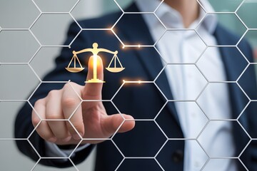Businessman in suit touches glowing digital scales of justice on a futuristic hexagonal network interface for modern law and tech solutions