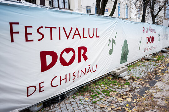 wde Chișinău banners along cobblestone street in Chișinău Moldova outdoor event