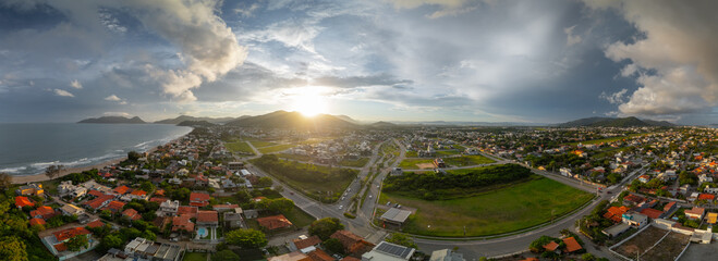 Aerial panorama of the Atlantic ocean coast and calm green neighborhood near the city of Florianopolis in Brazil © Dudarev Mikhail