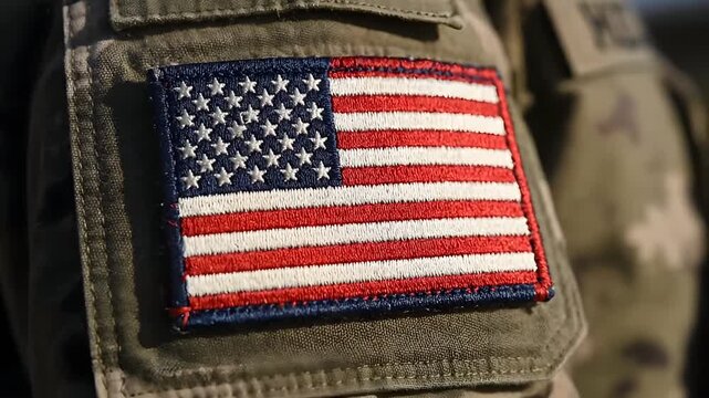 American flag patch on military uniform pocket, symbolizing patriotism and service, close-up view