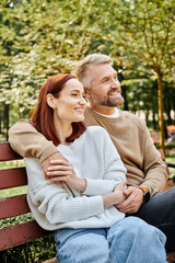 Fototapeta premium Couple enjoying a peaceful spring day in a lush green park