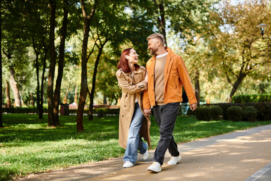 Spring stroll through a lush park brings joy to a loving couple