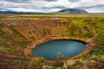 Panoramic view to the elliptical Keri&eth; Crater and the lake at the bottom. Volcanic crater lake located in the Gr&iacute;msnes area, South Iceland, along the Golden Circle. Site is popular area for tourists.