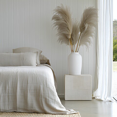 Minimalist bedroom with sheer curtains and large bay window, golden hour sunlight casting long shadows, neutral-toned bed linens, a single dried floral arrangement on the nightstand, warm and peaceful