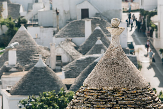Alberobello, Italy, famous for its unique trulli architecture. Trulli are traditional, small, dry-stone limestone dwellings with distinctive conical roofs. 

