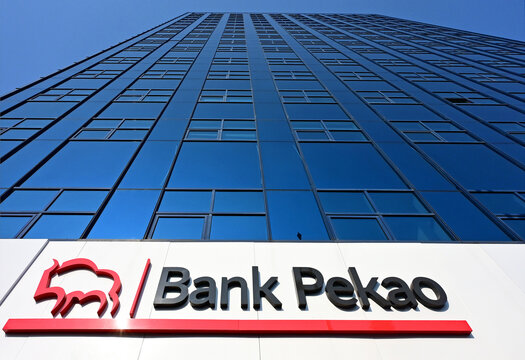 Lodz, Poland, Europe - 16.08.2025 : Logo and name of of Bank Pekao (Bank Polska Kasa Opieki) on glass facade of skyscraper in city center, the second largest bank in Poland, Sienkiewicza street