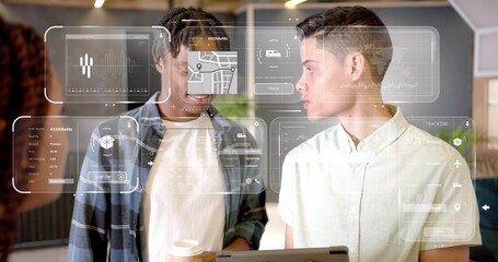 Discussing coworkers in plaid shirt and short-sleeve, reviewing AR tablet with coffee cup in office