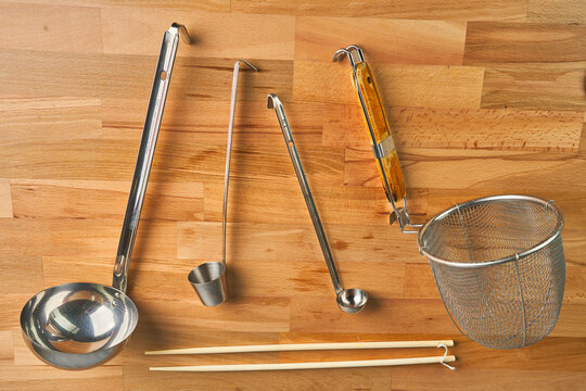 Ramen cooking tools on wooden culinary background