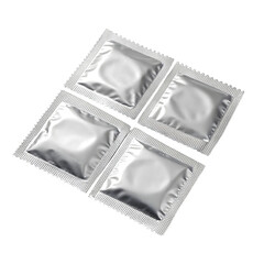 Four silver square condom foil packets arranged together on transparent background