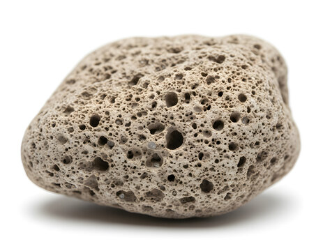 Close-up of a lightweight, porous pumice stone on a clean white background