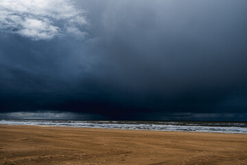 Dark, threatening rain clouds over the beach of Katwijk aan Zee in the Netherlands