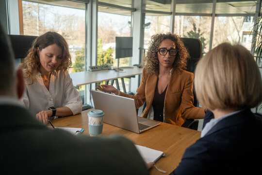 Businesswoman disappointed with team performance during stressful office meeting
