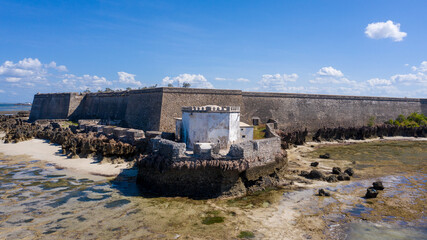 Aerial view of the Fortaleza de Sao Sebastiao, a stark stone fortress against the azure sea and sky, stands as a testament to time, Ilha de Mocambique, Nampula, Mozambique.