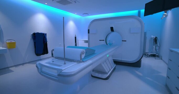 Small dolly shift is nudging camera while CT scanner and table are remaining idle for framing
