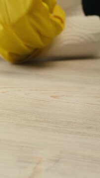 Cleaning service, Close up of woman cleaning table at home with spray. Homework, clean of ditry kitchen table with surface cleaner spray, all-purpose cleaner spray, multi-surface cleaning spray