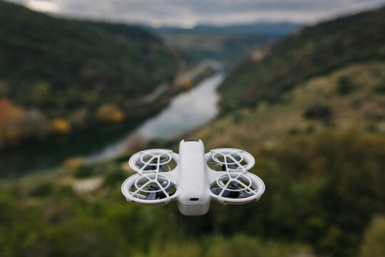 Drone hovering over scenic valley landscape