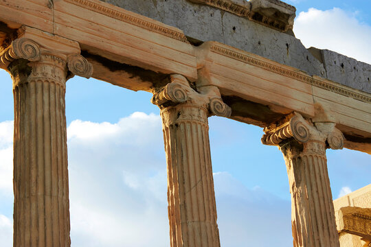 Ancient columns of the Erechtheion against a blue sky