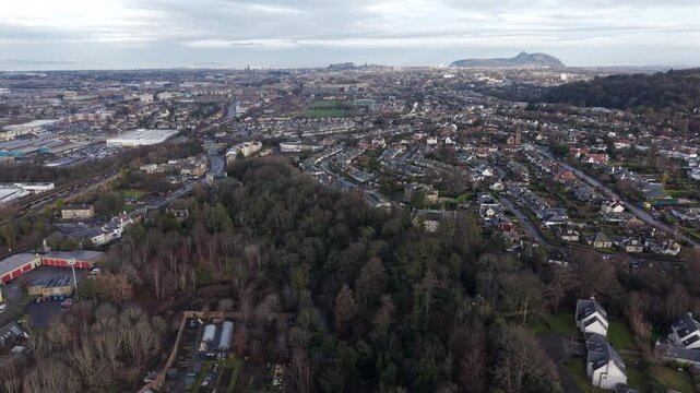 Panoramic aerial view of Edinburgh cityscape with the iconic Arthur's Seat hill in the background, Scotland