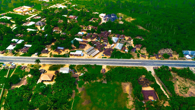 Aerial view of buildings and roads interspersed with lush greenery, creating a vibrant tapestry of human settlement and nature's embrace, Ahoada, Rivers State, Nigeria.